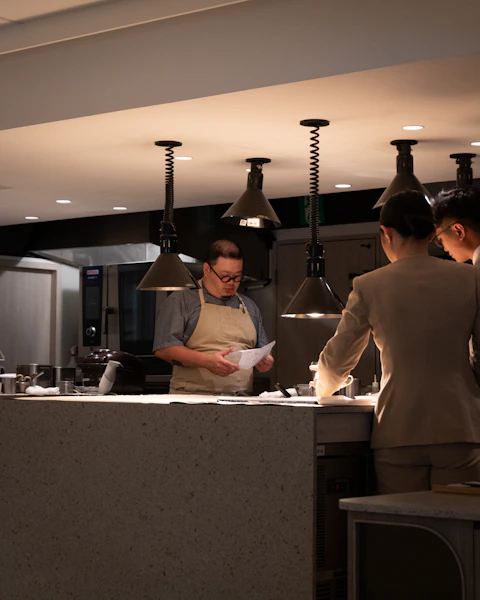 Restaurant owner reviewing financial reports