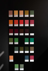 A black wall with a bunch of colors on it