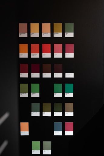 A black wall with a bunch of colors on it