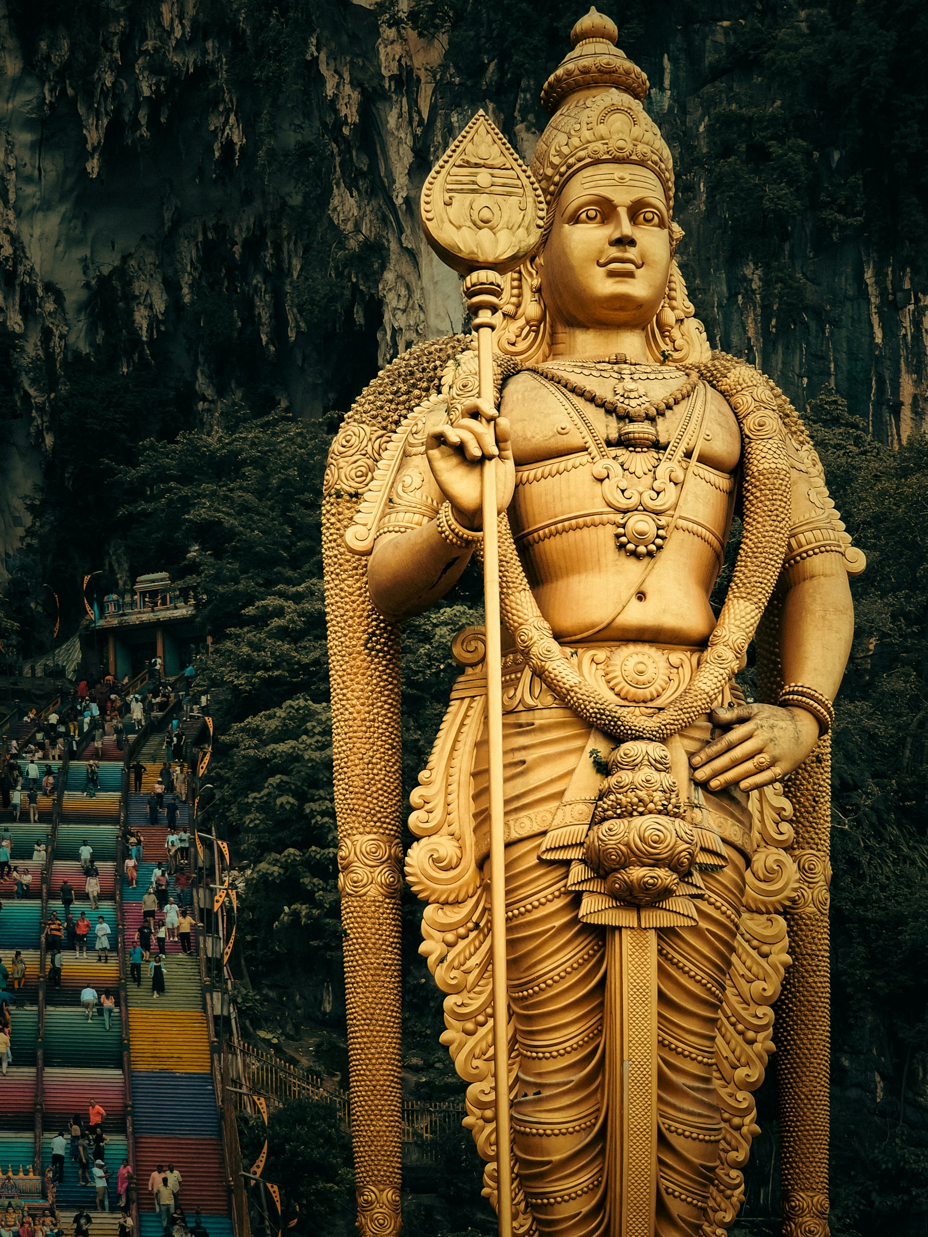 A large statue of a man holding a spear
