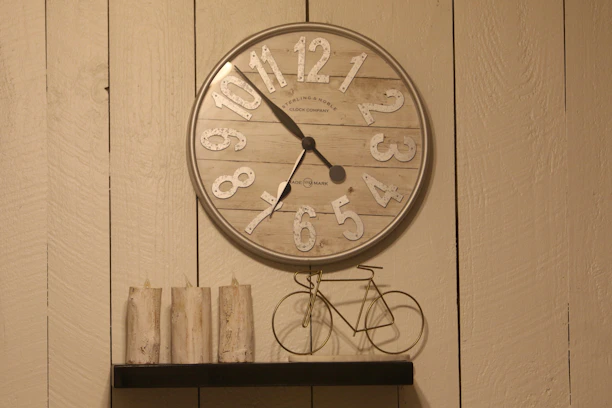 A clock that is on the side of a wall