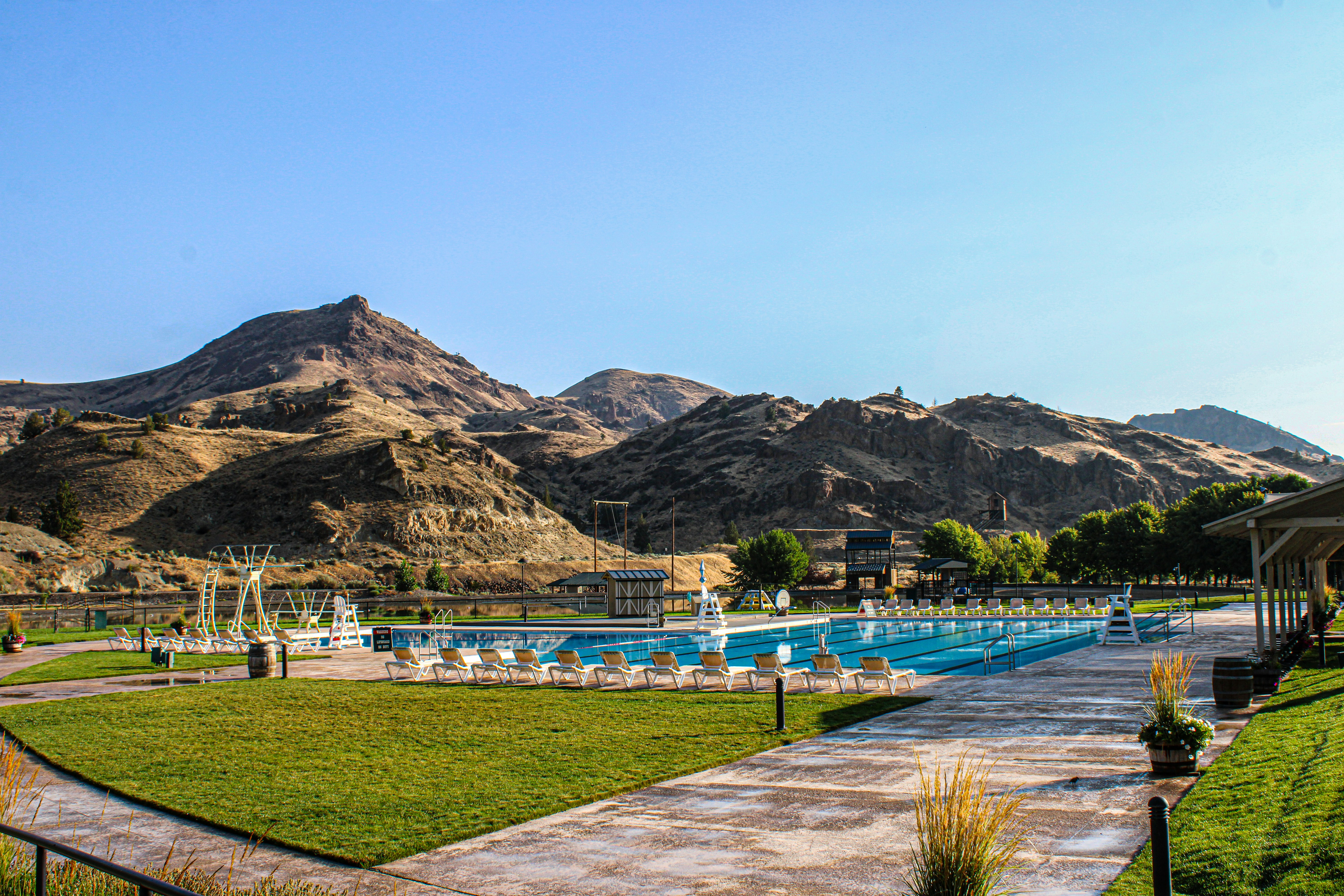 luxury resort swimming pool with mountains in background