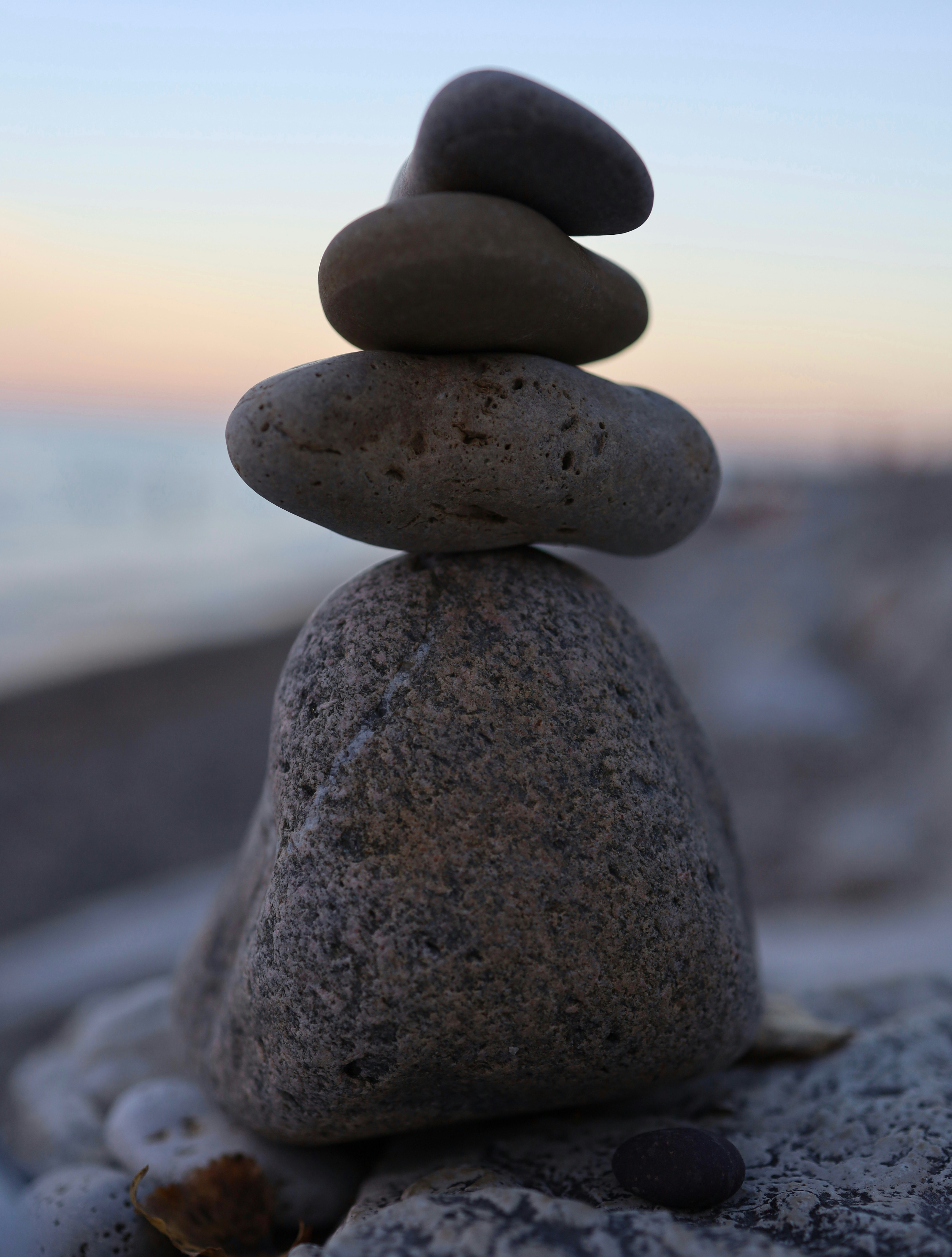 A stack of rocks sitting on top of a beach