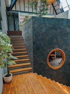 A room with a wooden floor and stairs