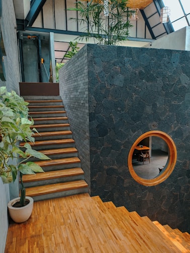 A room with a wooden floor and stairs