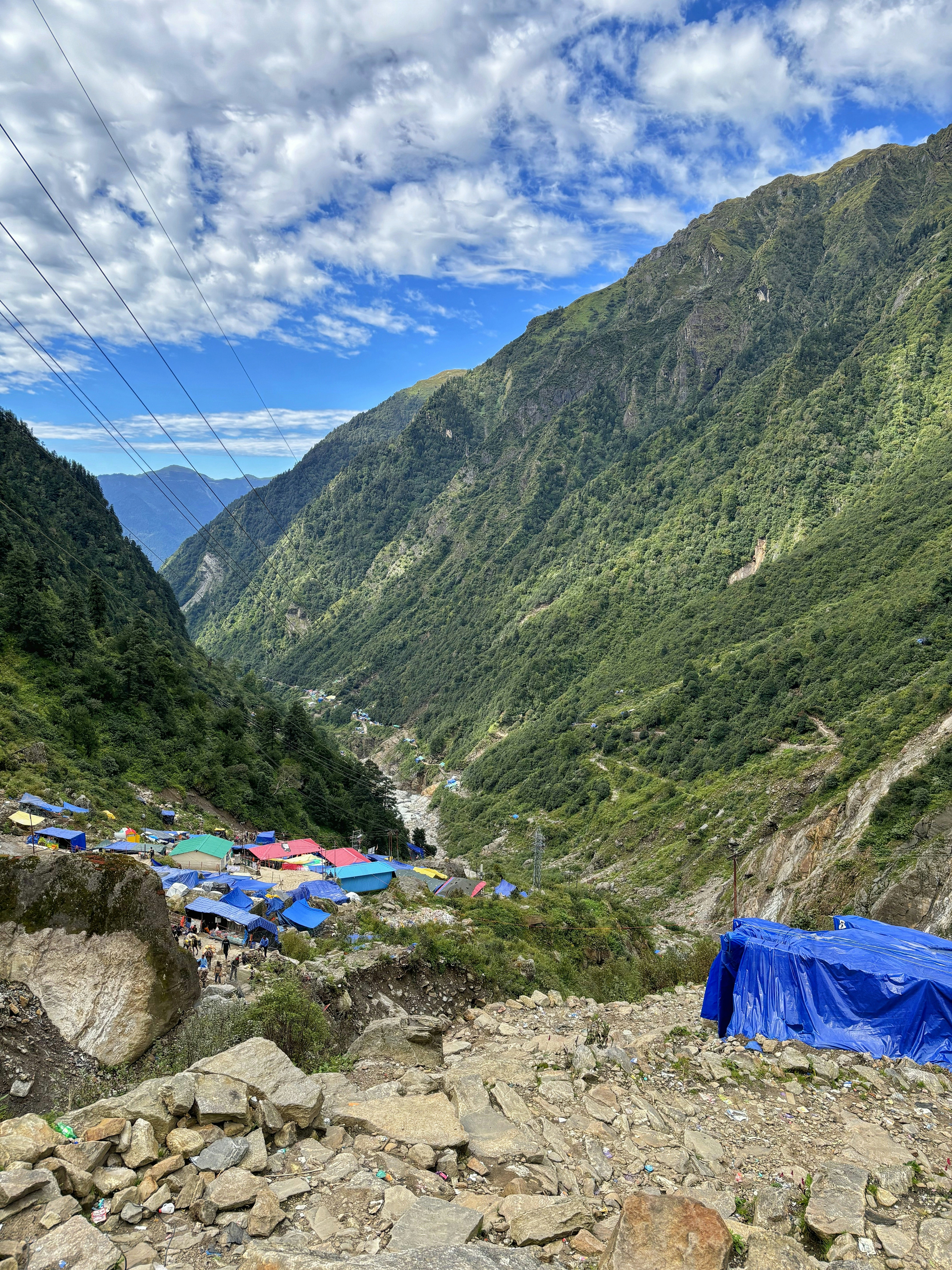 A blue tarp sitting on the side of a mountain