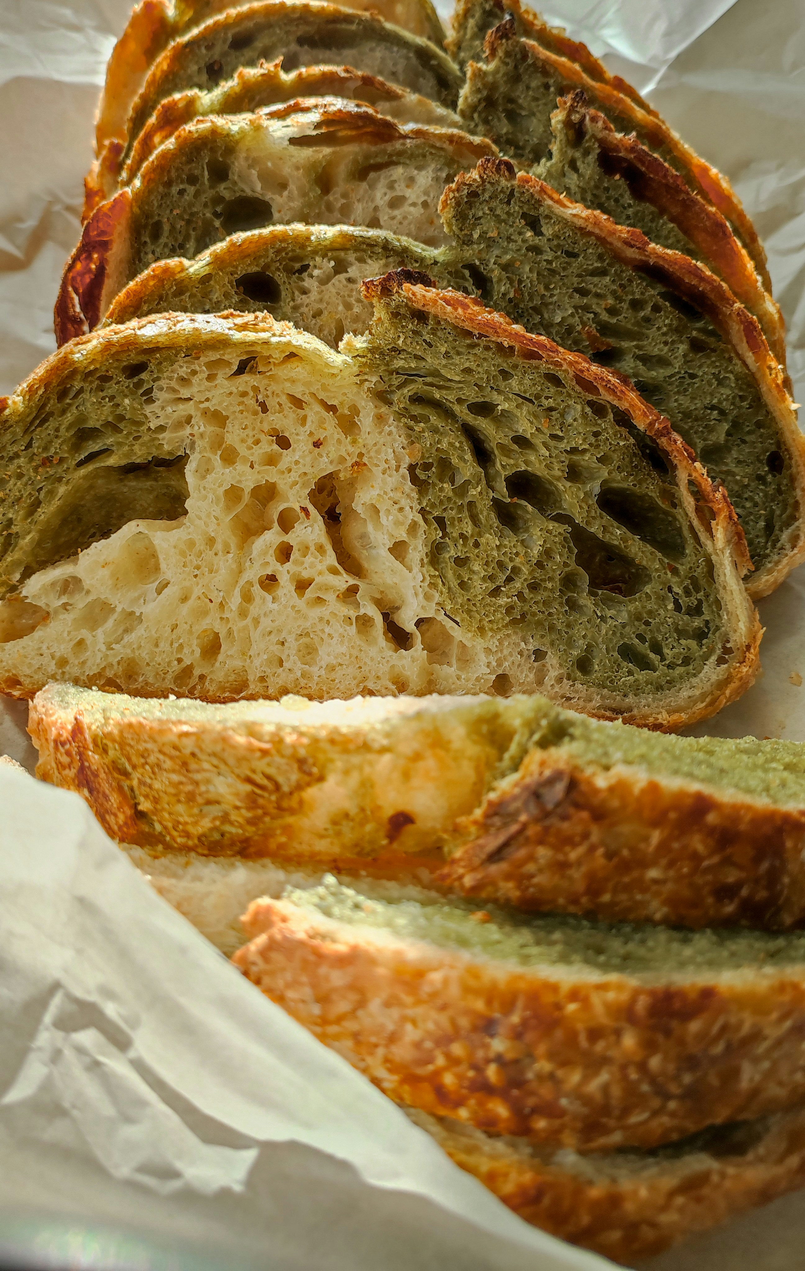 A loaf of bread sitting on top of a piece of wax paper