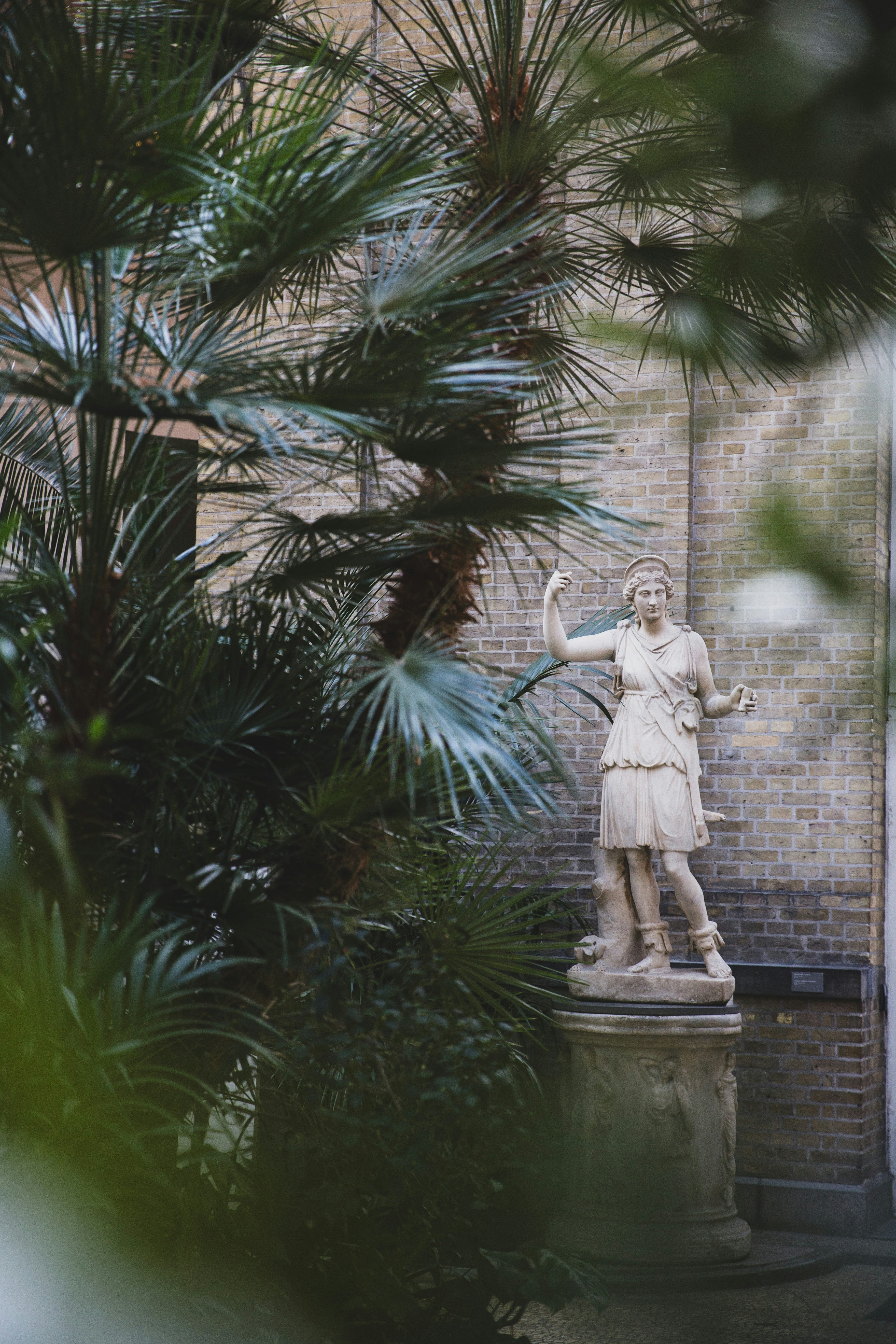 A statue of a woman in a courtyard