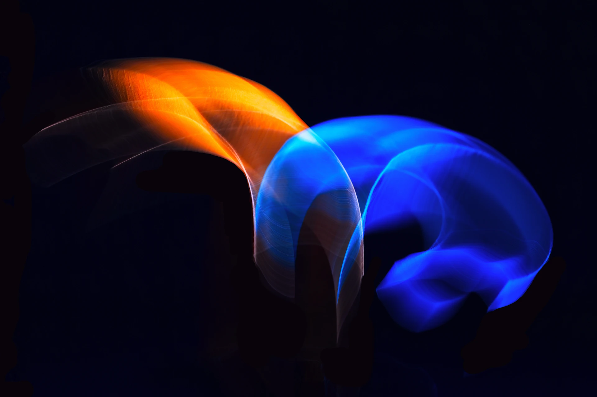 A blurry photo of a blue and orange object