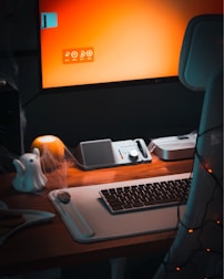 A desktop computer sitting on top of a wooden desk