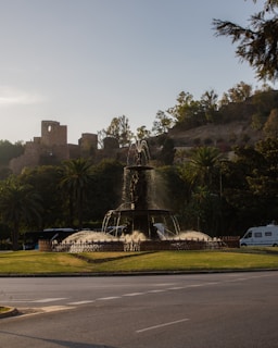 A park with a fountain in the middle of it