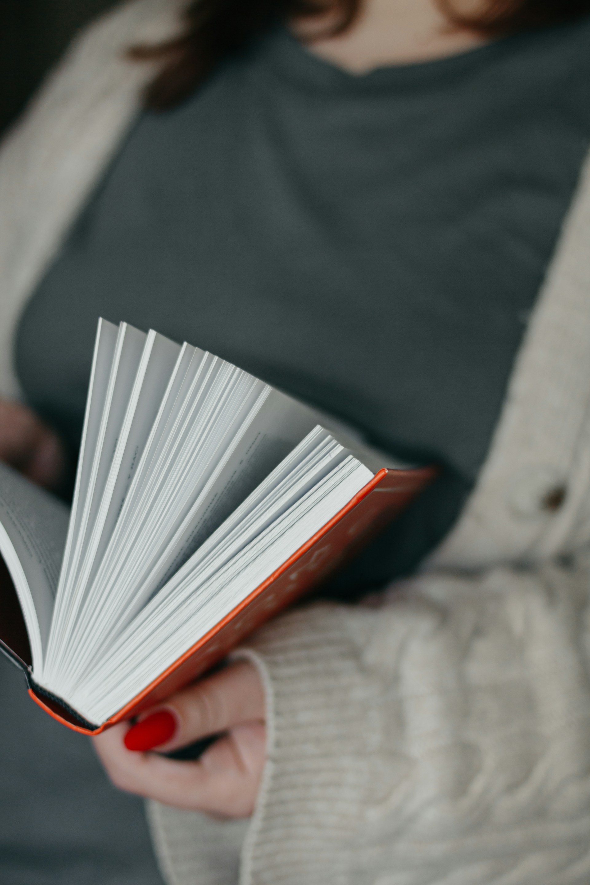 A woman holding a book in her hands