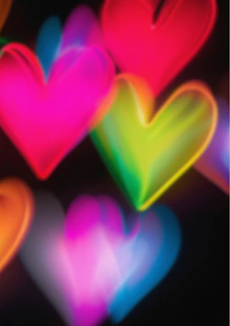 A bunch of hearts that are glowing in the dark