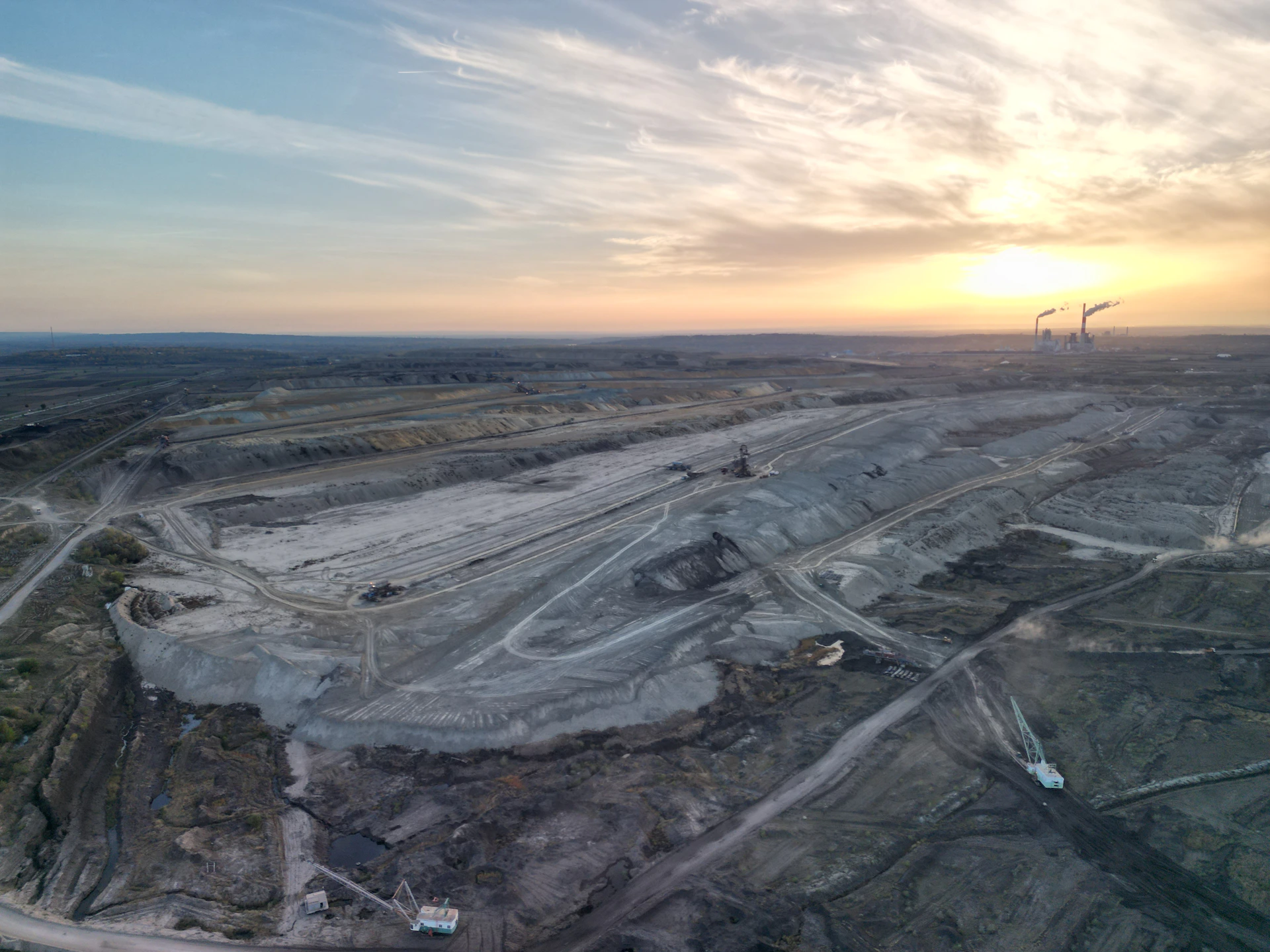 An aerial view of a construction site at sunset