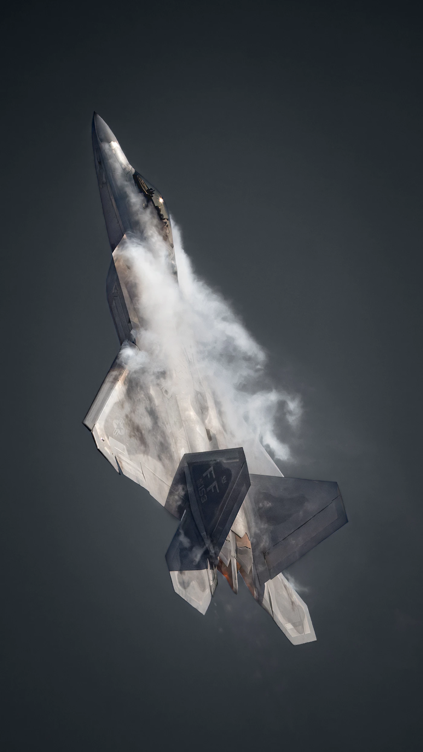 F-22 Raptor fighter jet in high-alpha climb