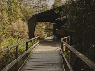 A wooden walkway leads to a covered walkway