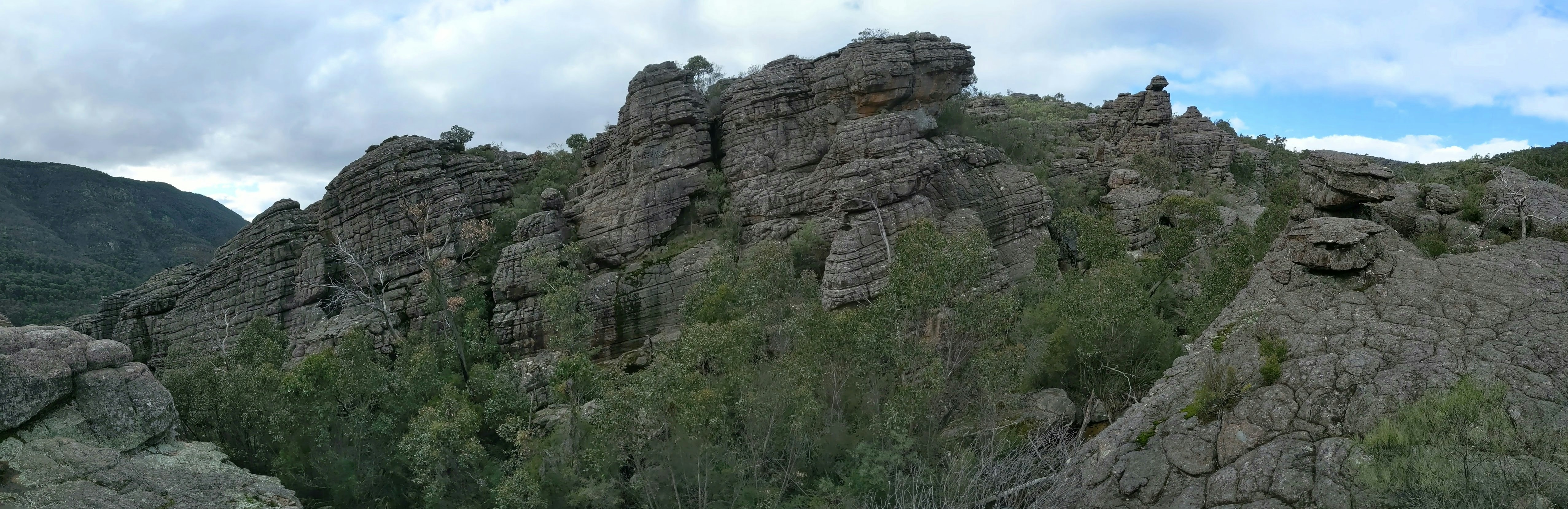 A group of people standing on top of a mountain
