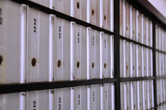 A row of white folders sitting on top of a wall