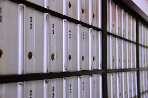 A row of white folders sitting on top of a wall