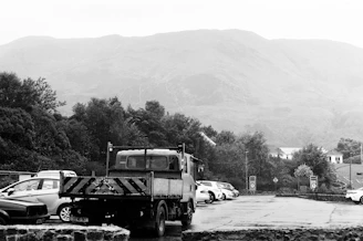 A black and white photo of a parking lot