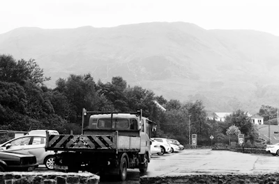 A black and white photo of a parking lot