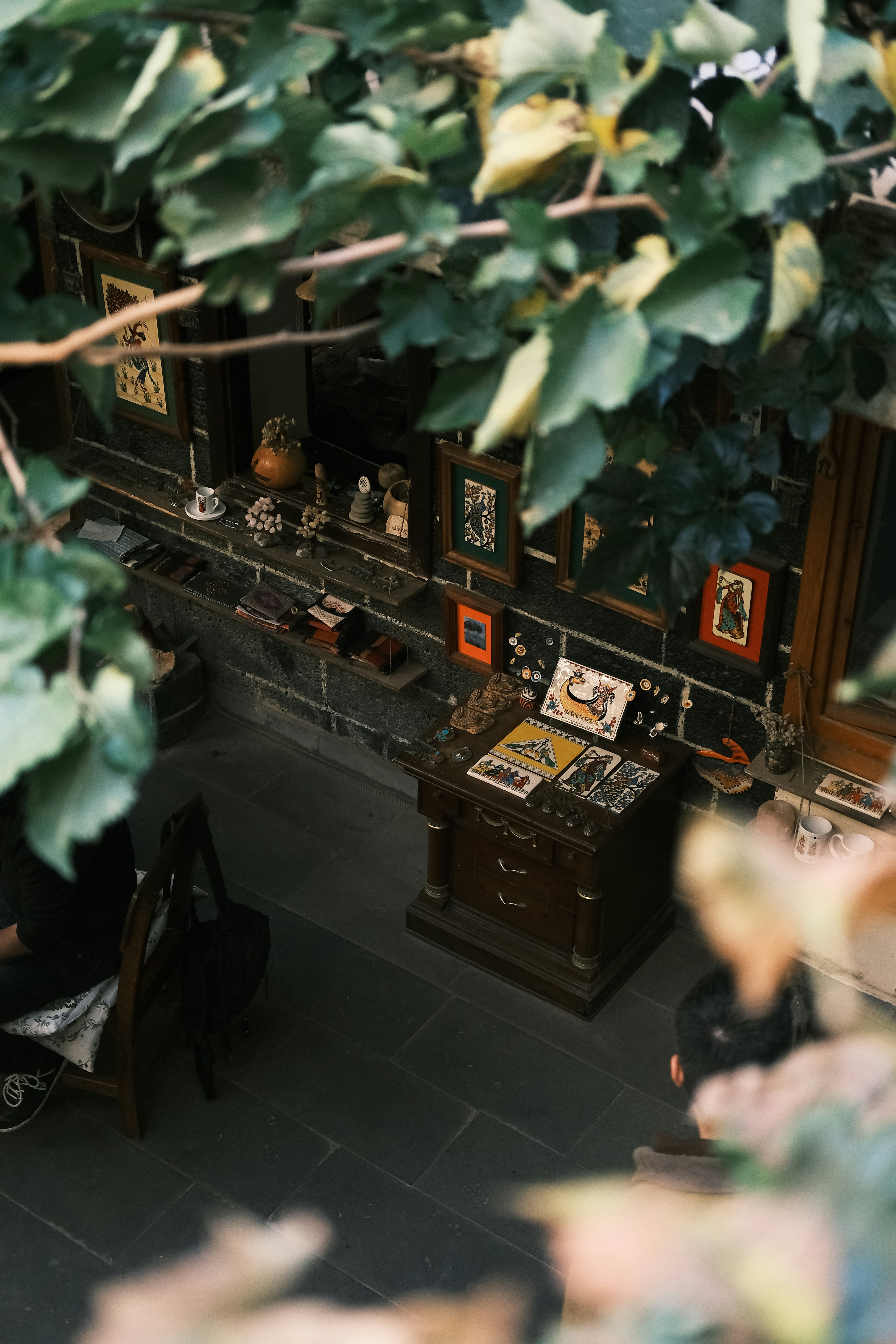An overhead view of a room with a desk and a chair