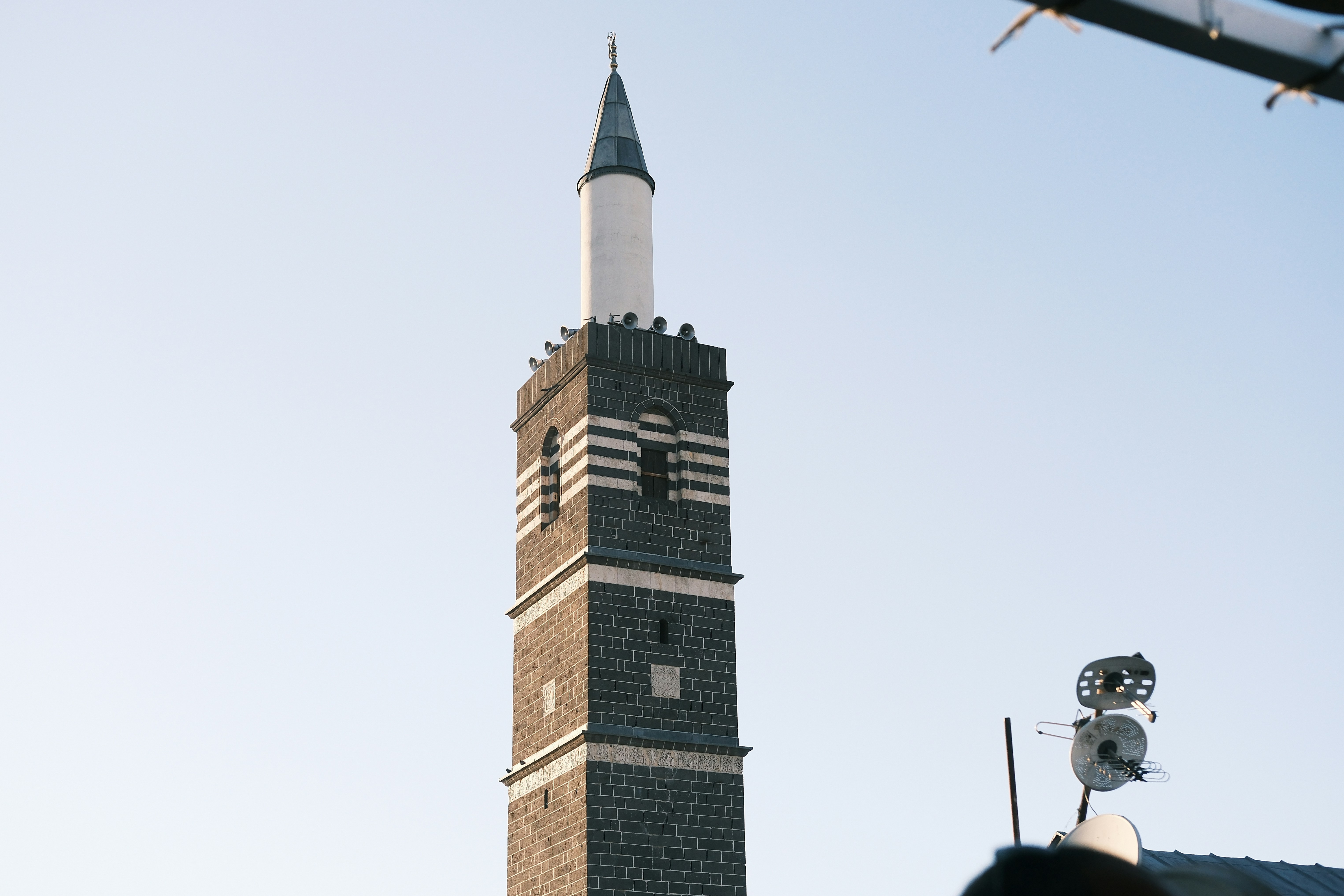 A tall clock tower towering over a city