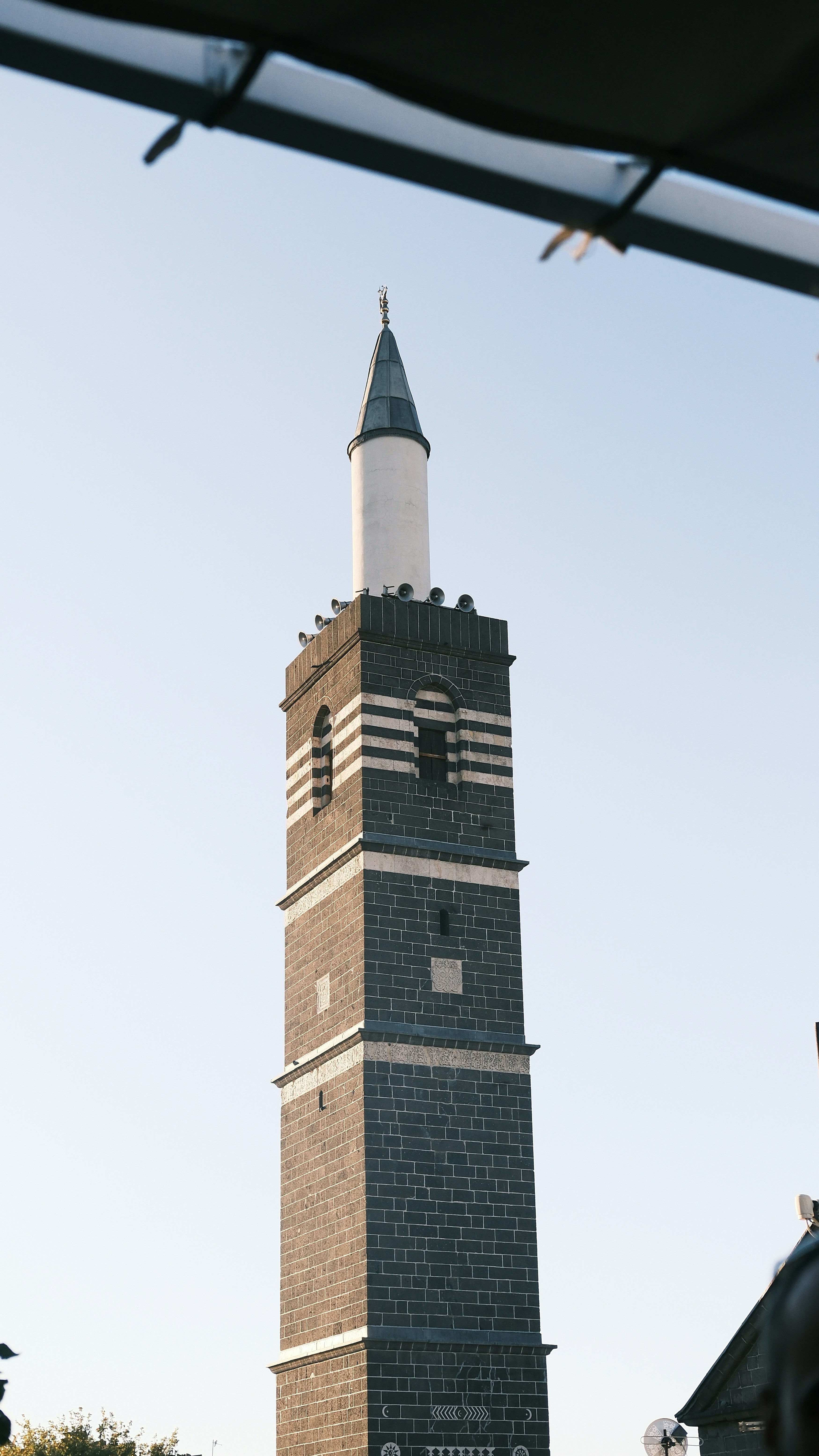 A tall clock tower towering over a city
