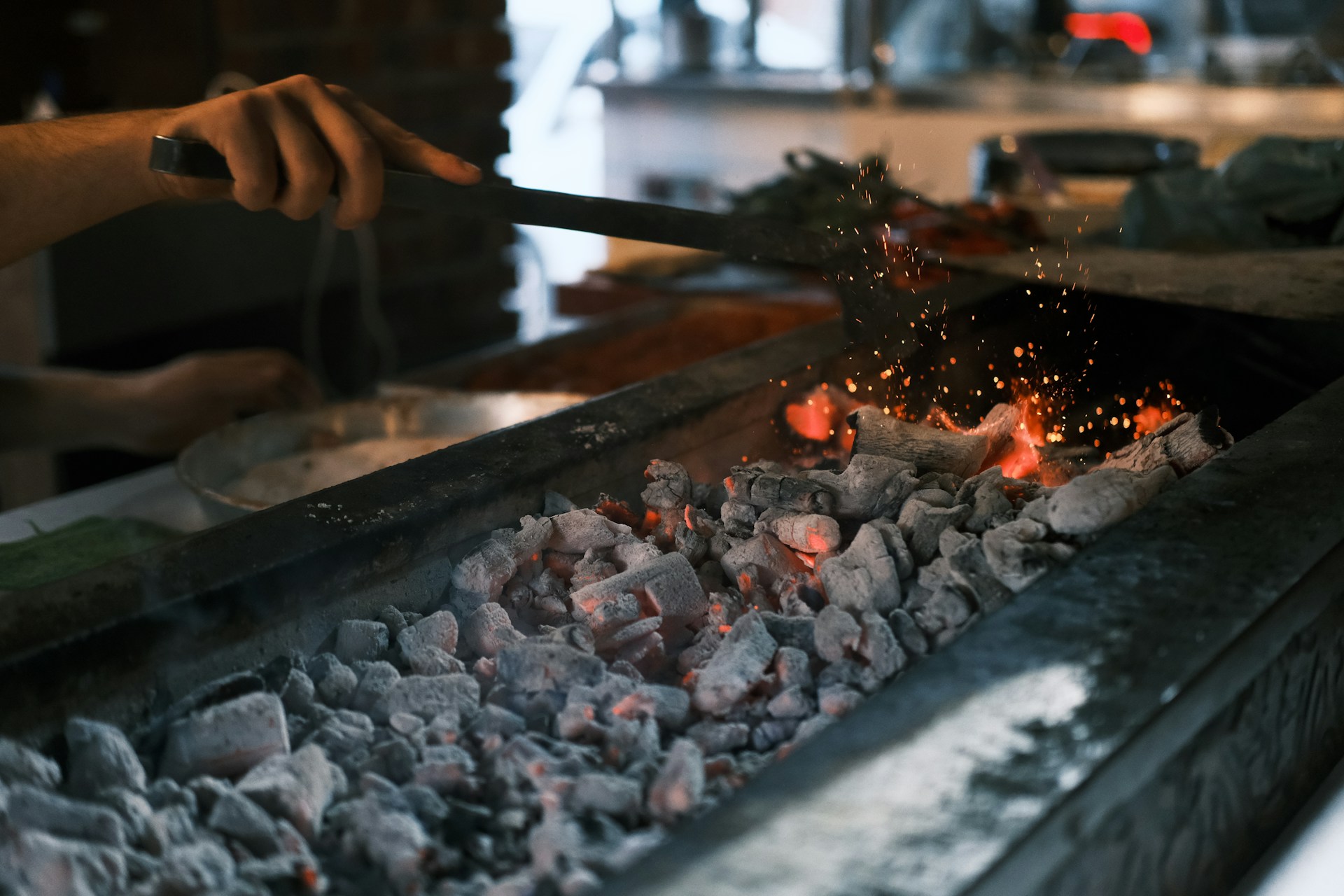 A person is cooking something on a grill