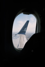 A view of the wing of an airplane through a window