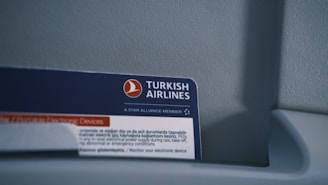 A close up of a business card on a toilet