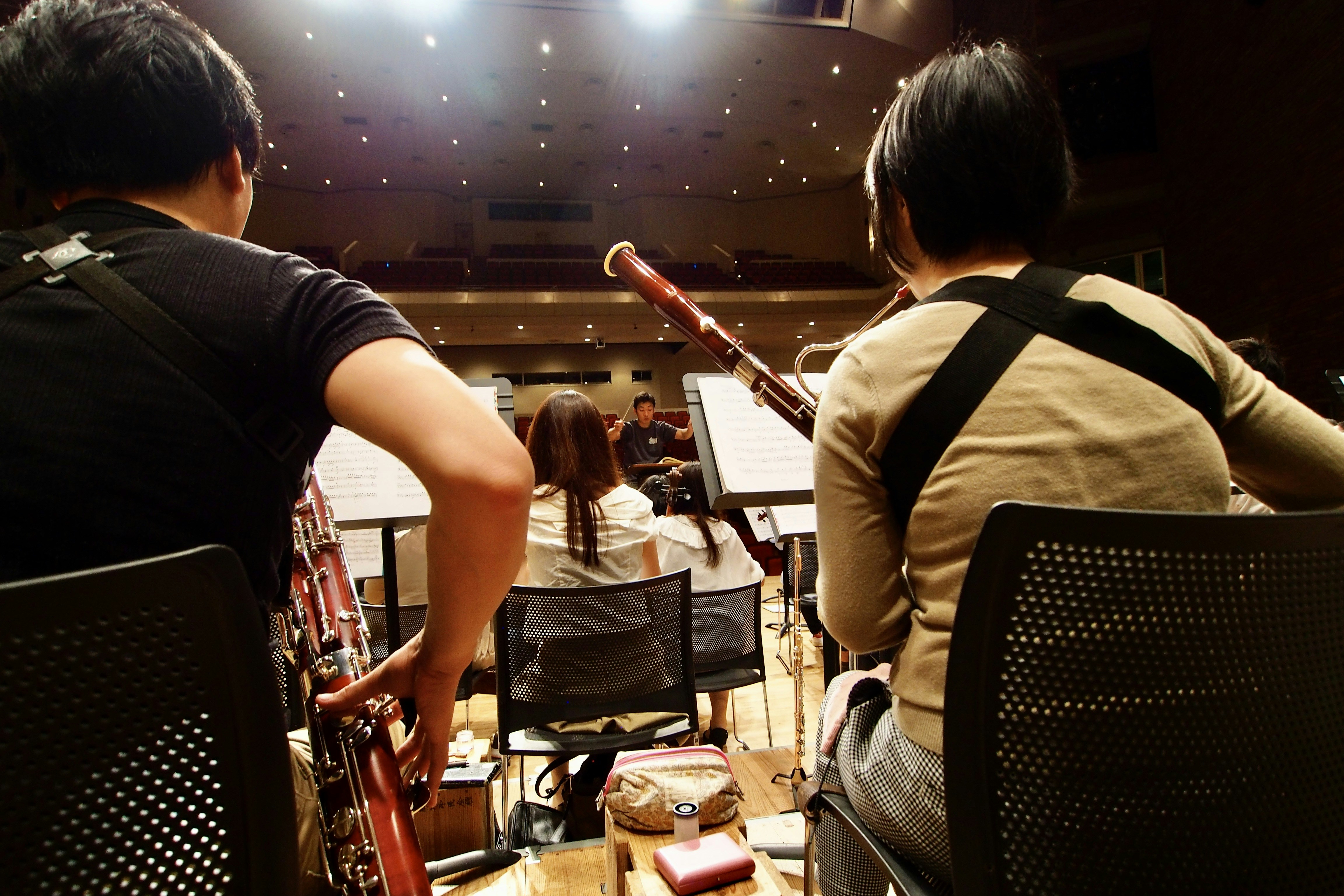 A couple of people that are sitting in chairs