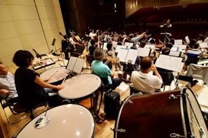 A group of people sitting in front of musical instruments