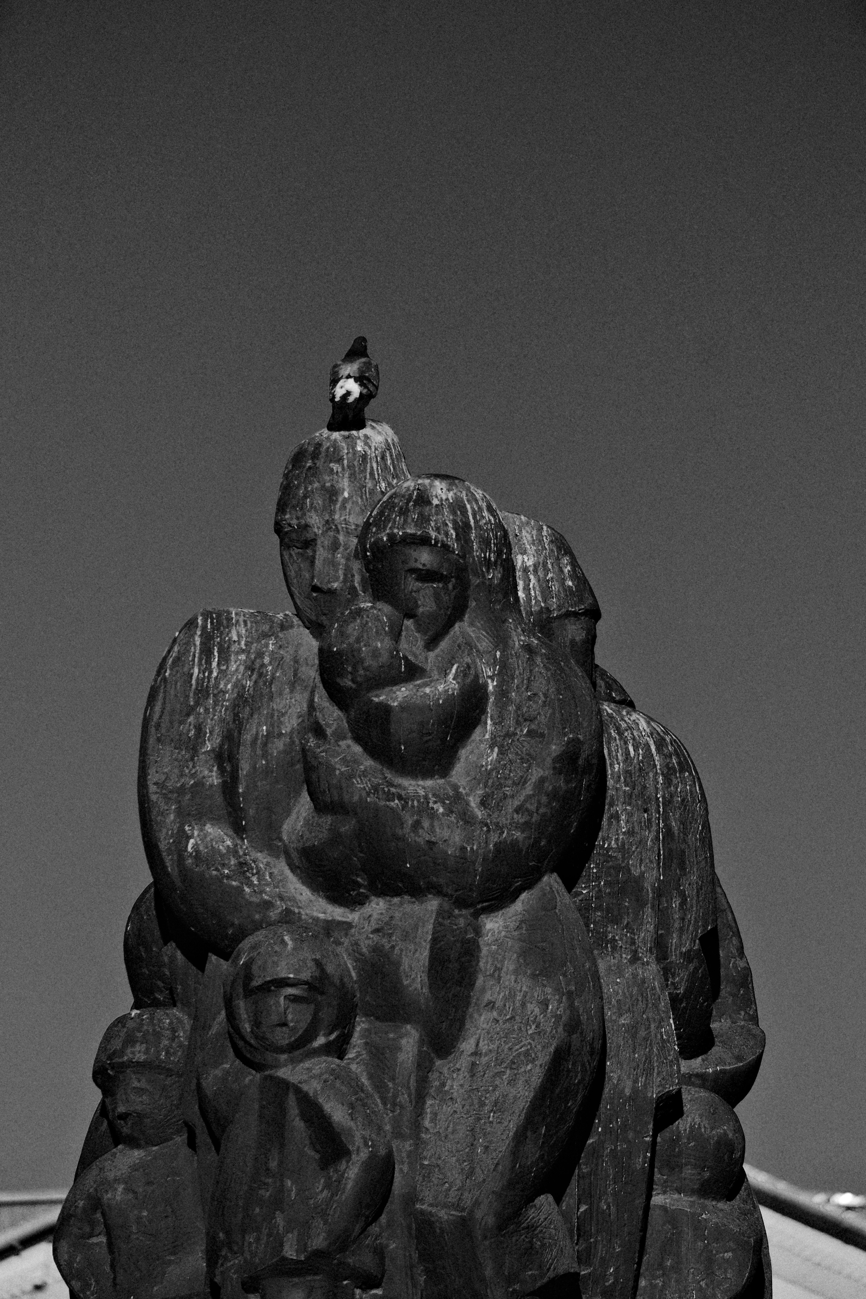 A black and white photo of a statue