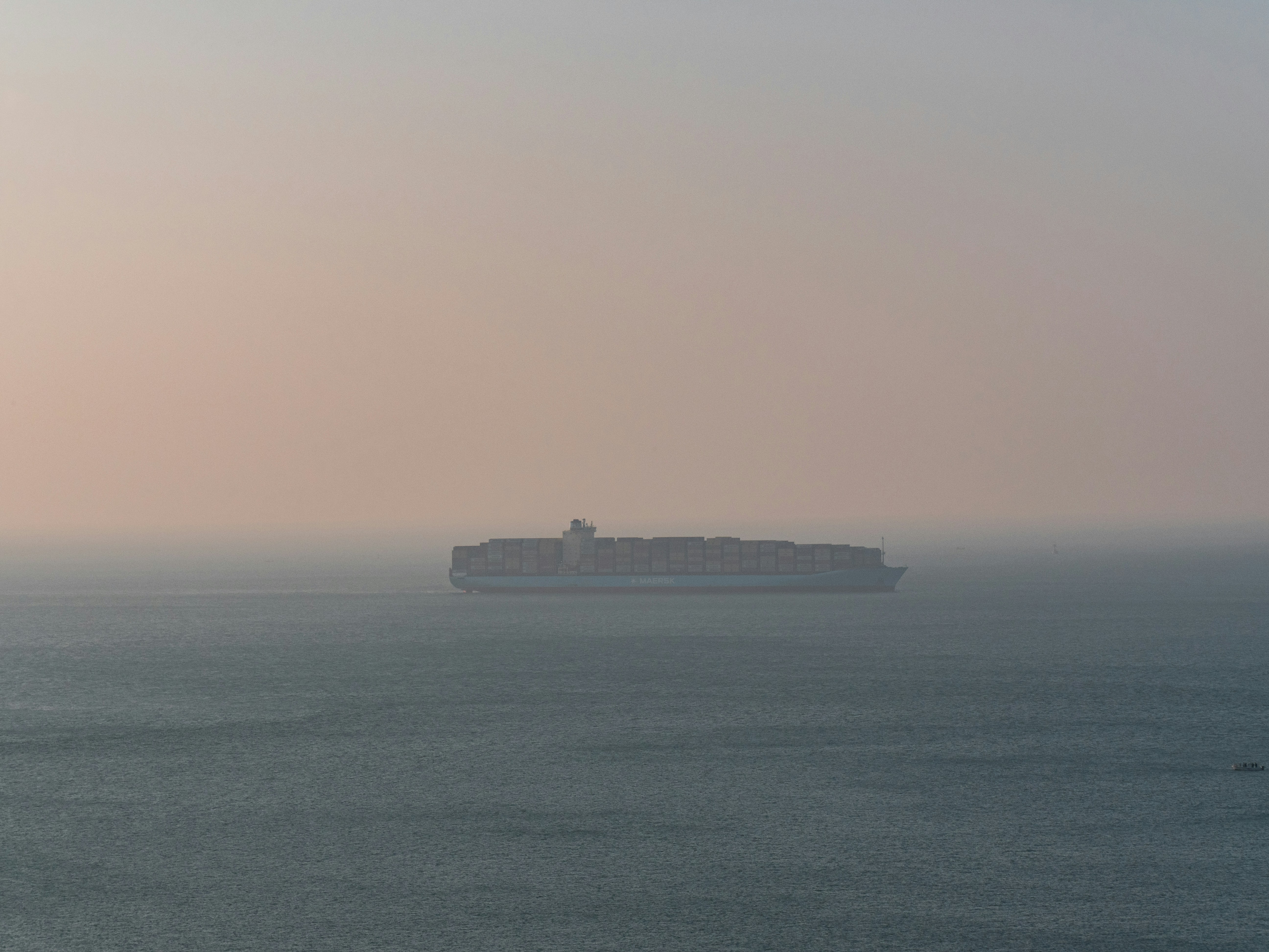 A large ship in the ocean on a foggy day