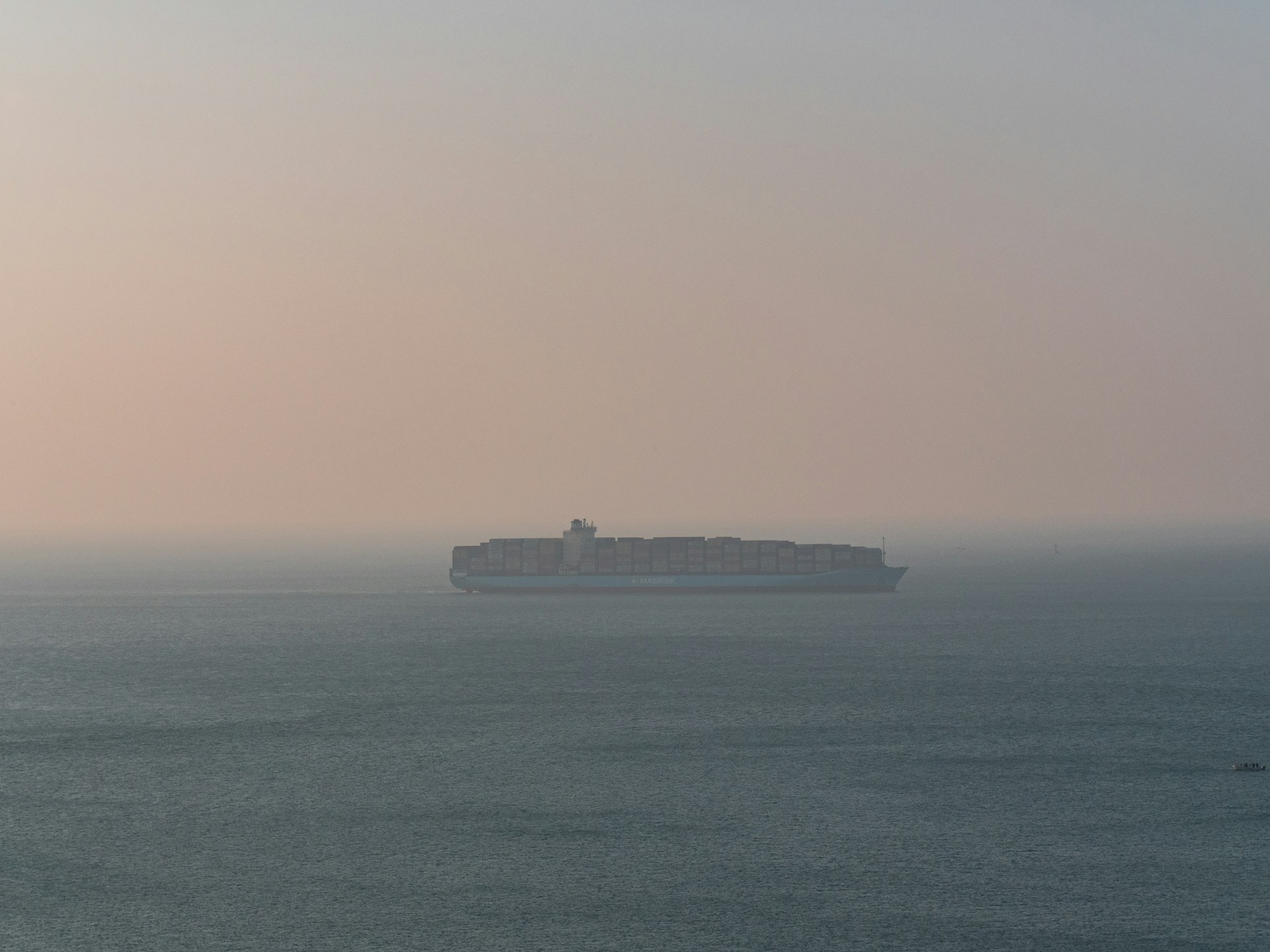 A large ship in the ocean on a foggy day
