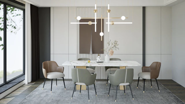 Long white marble dining table with sage chairs and a modern chandelier