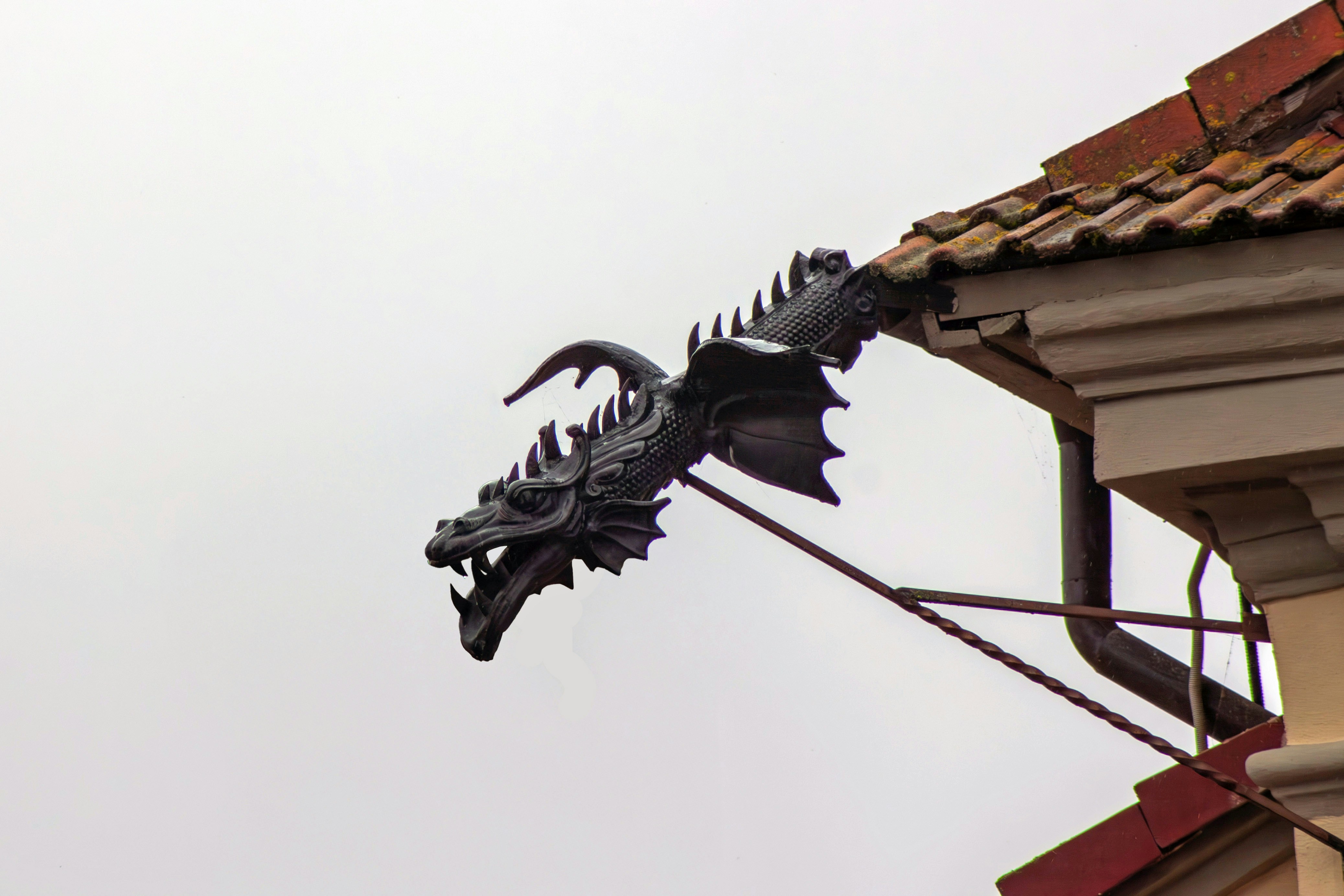 Intricate steampunk mechanical dragon made of brass and gears, coiled around a giant victorian clock tower, detailed illustration