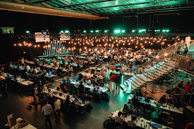 A large room filled with lots of tables and chairs