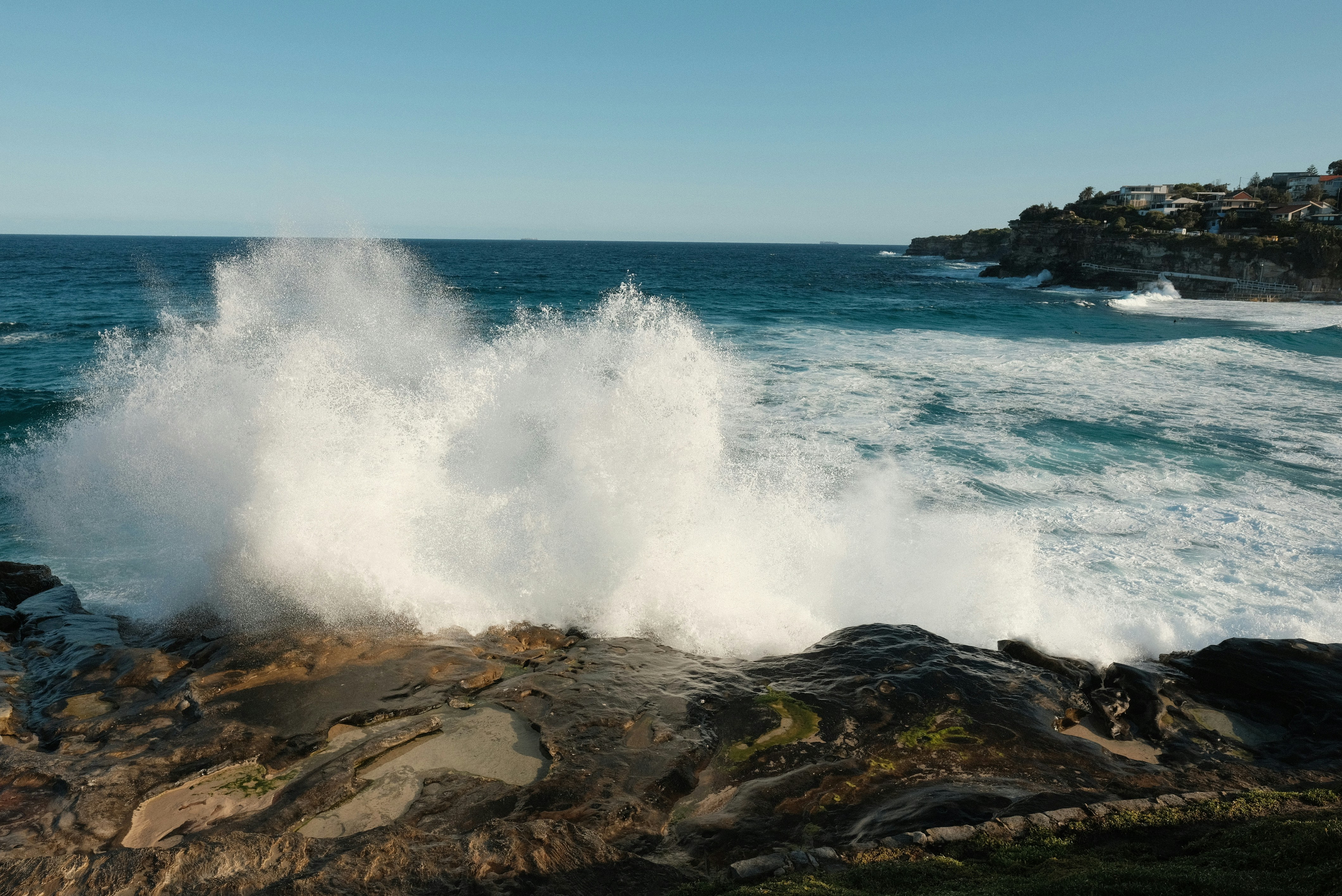 A large wave hitting on a rocky shore photo – Free Wallpaper Image on ...