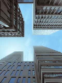 Looking up at tall buildings in a city