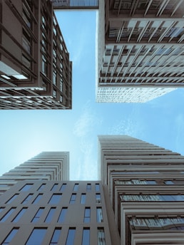 Looking up at tall buildings in a city