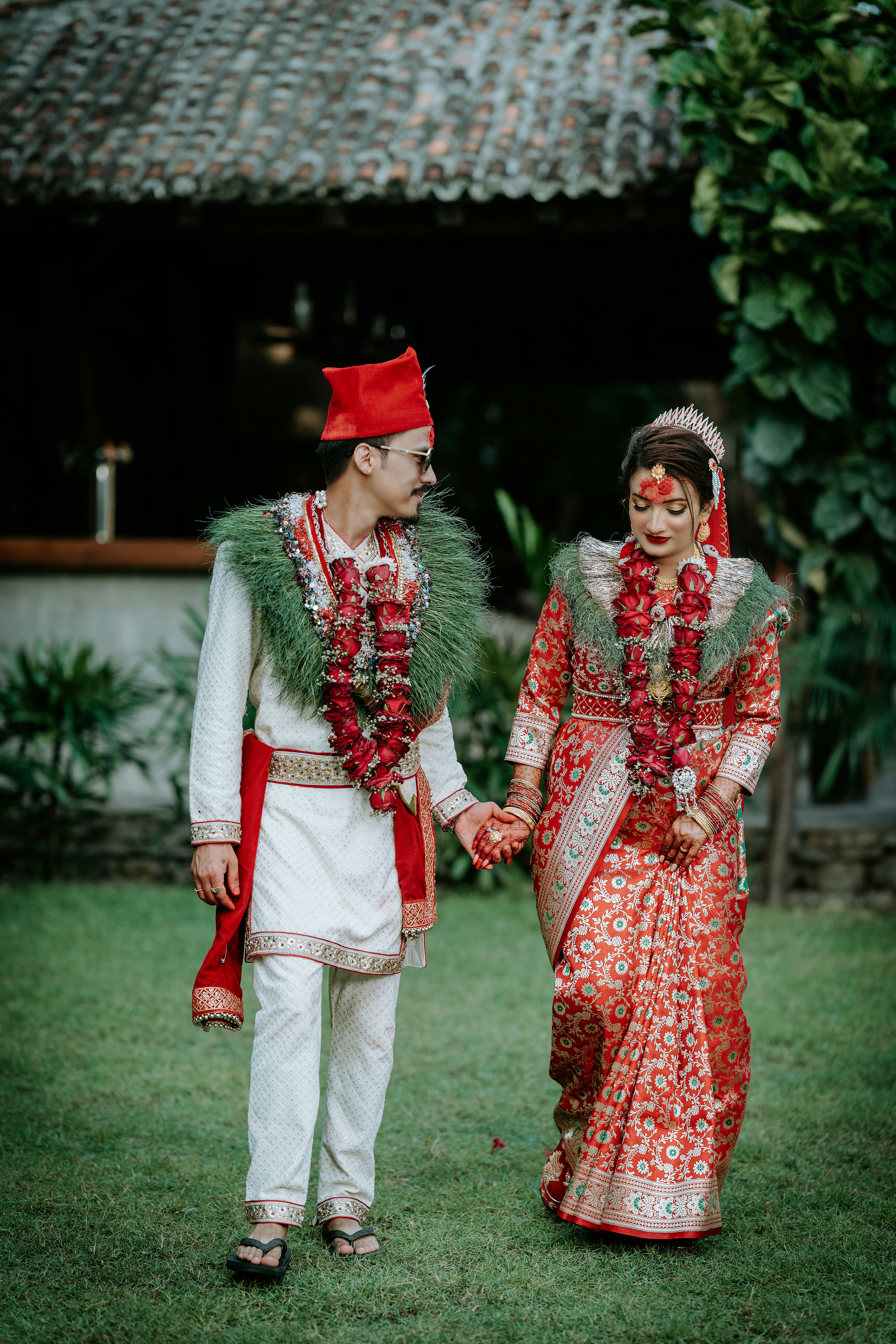 A bride and groom dressed in traditional indian garb