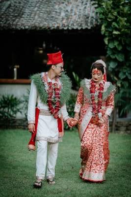 A bride and groom dressed in traditional indian garb