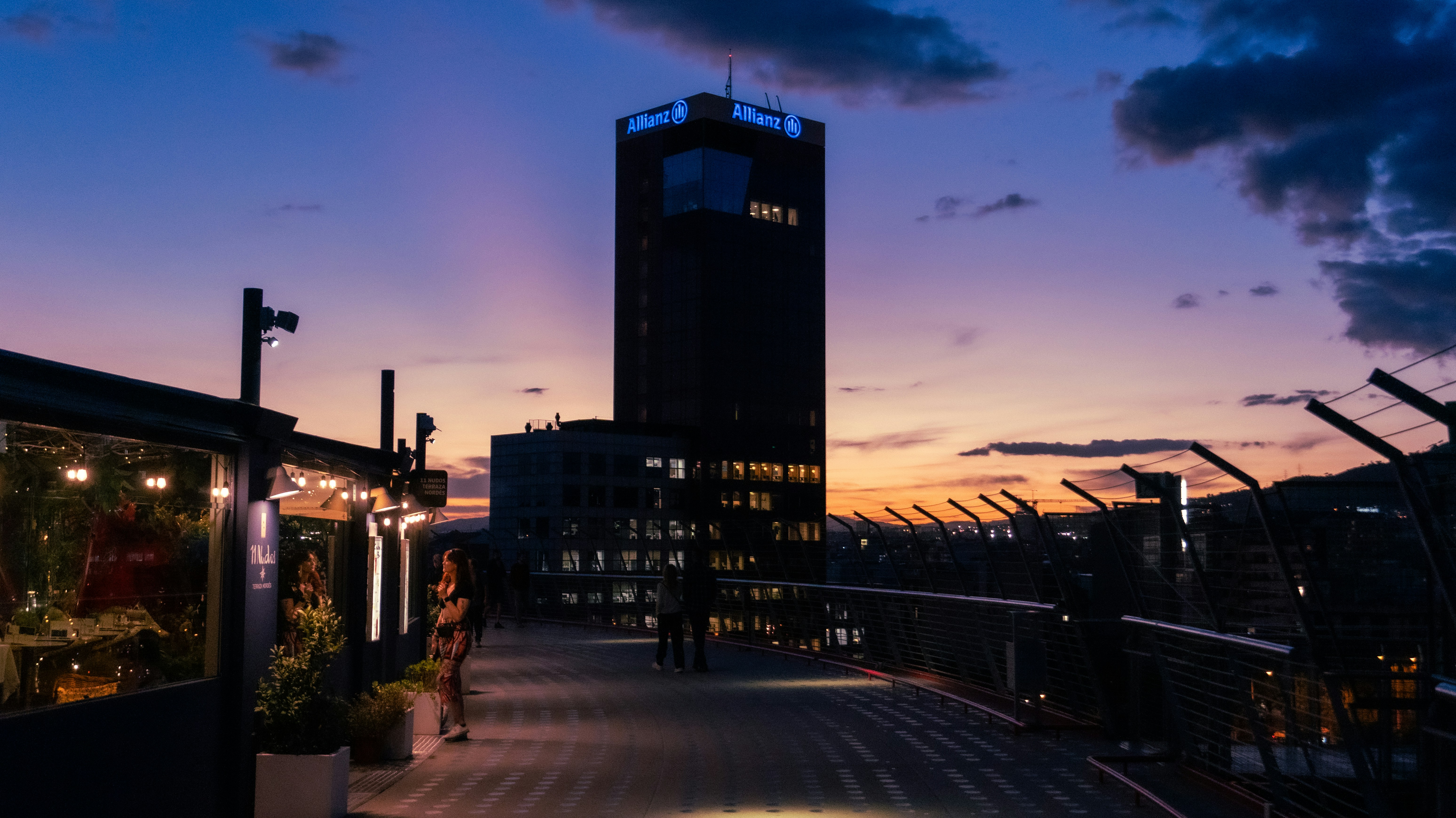 A city street with a clock tower in the background, 