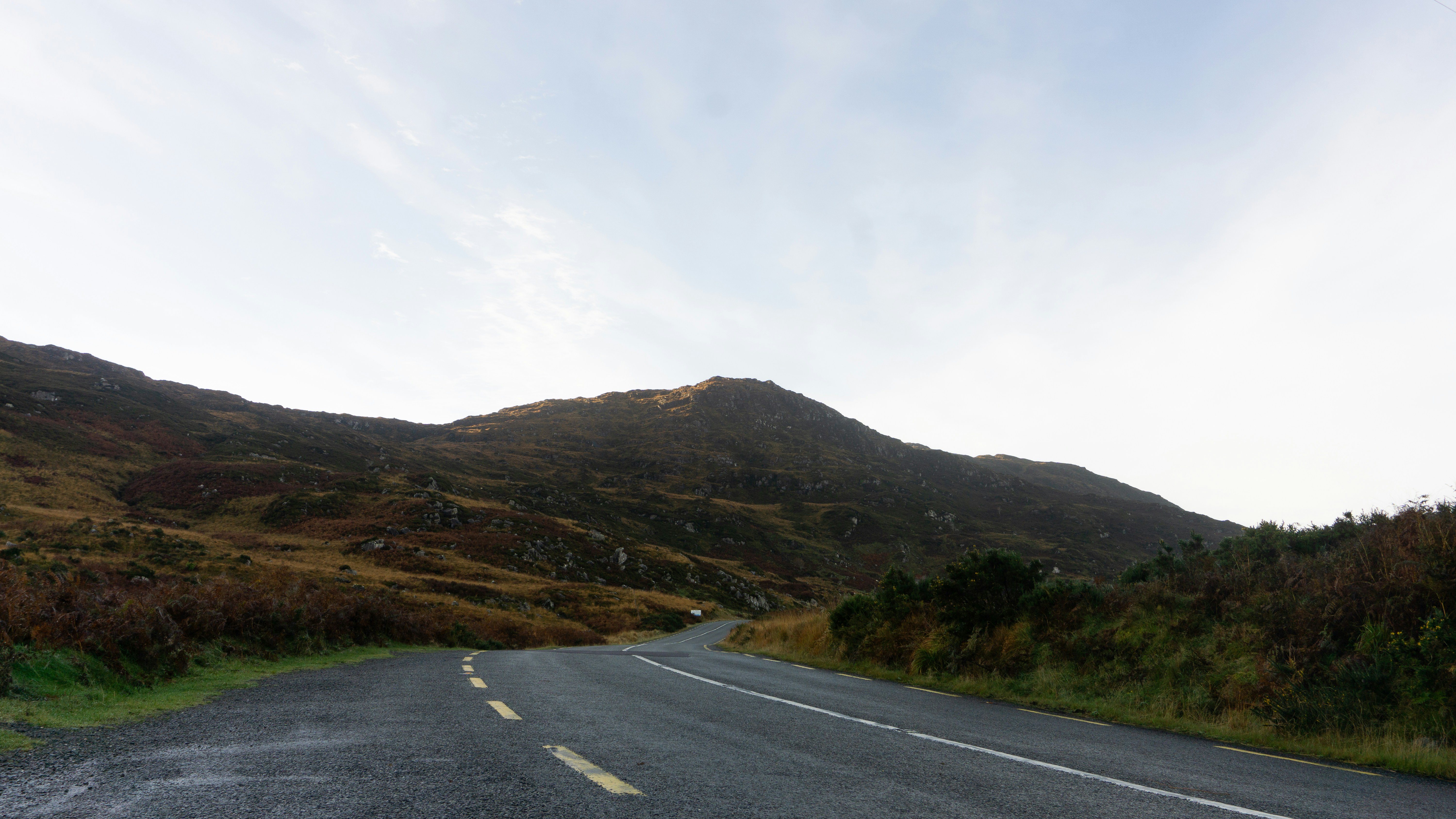 A road with a mountain in the background, 