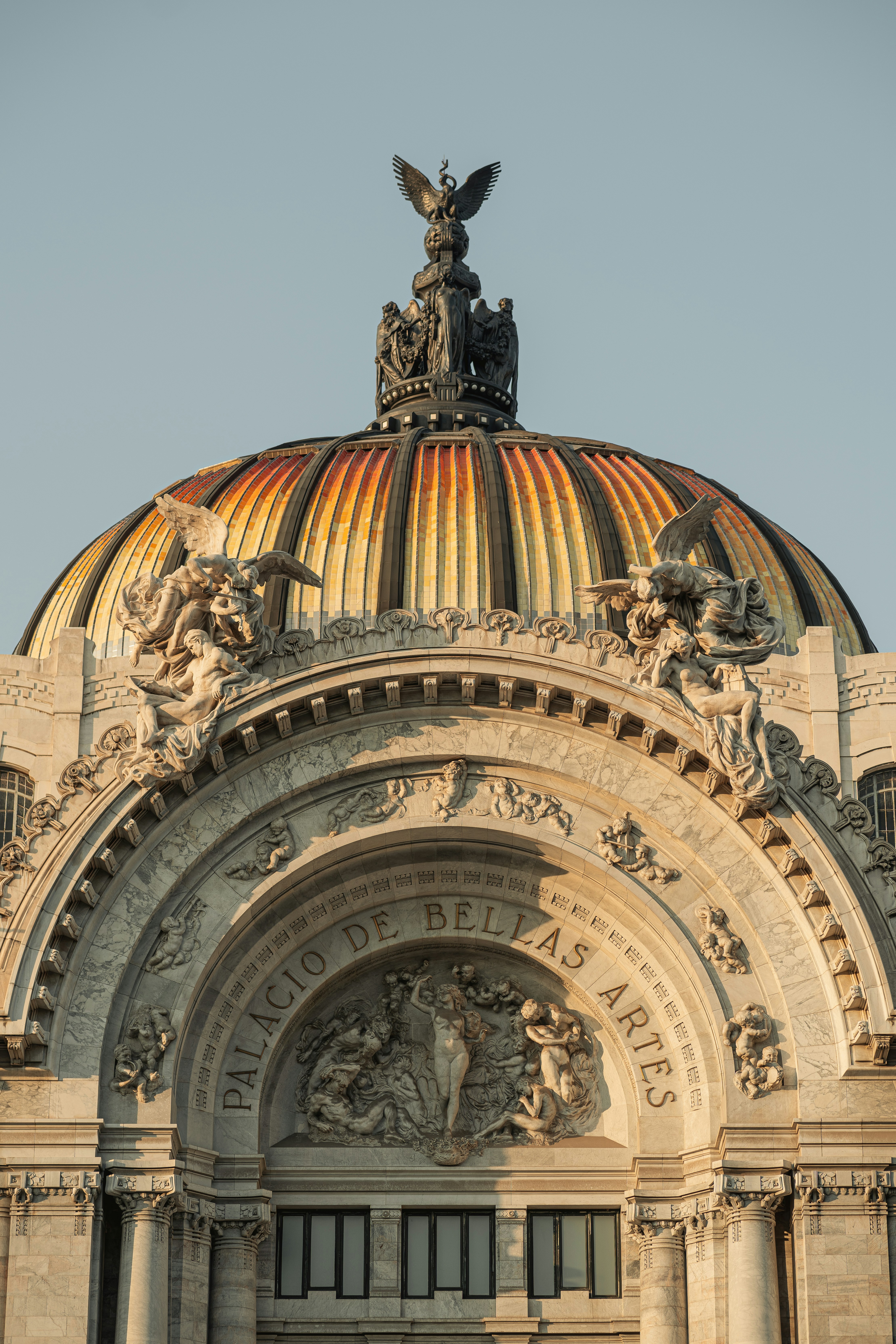 A large building with a statue on top of it