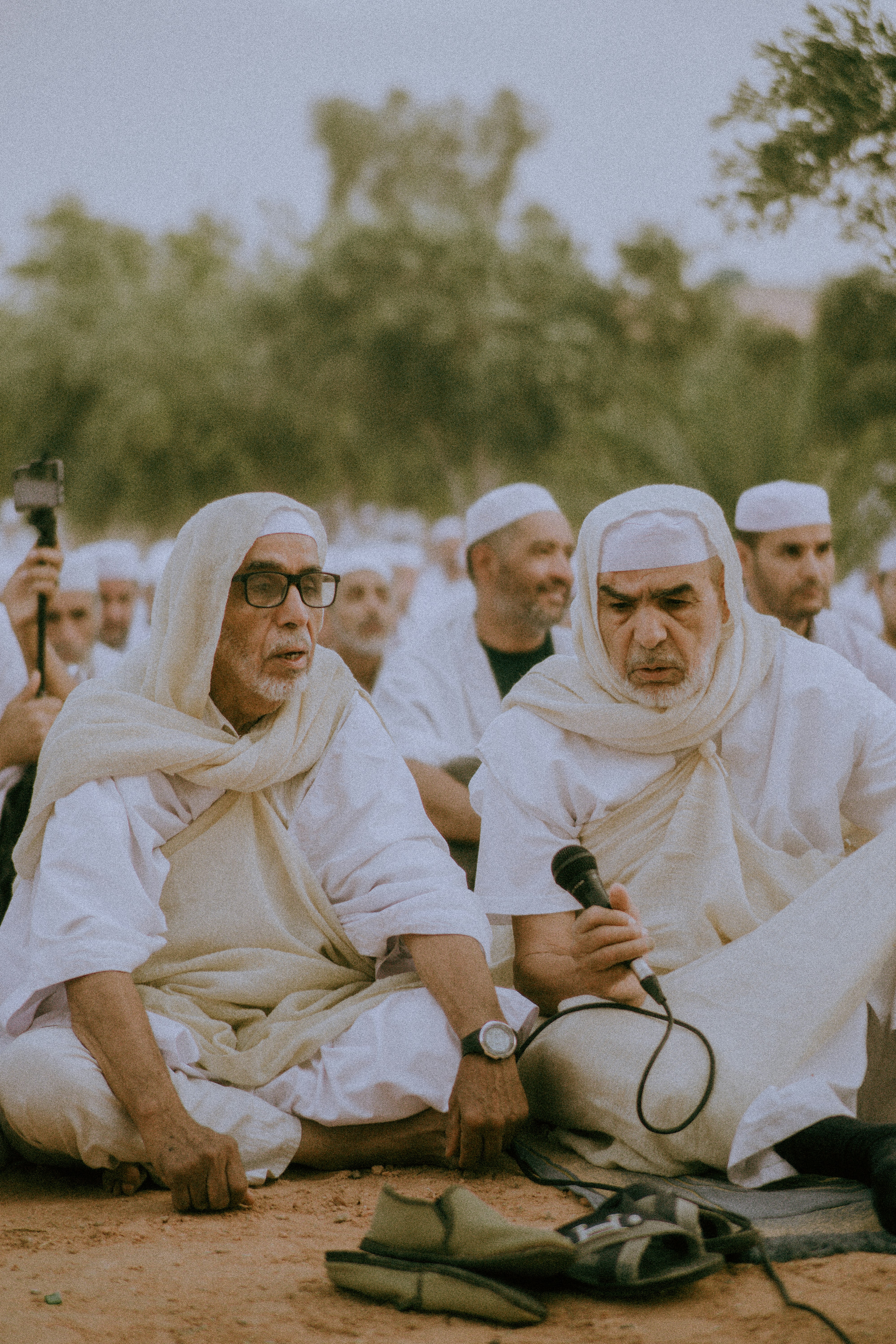 A group of men sitting next to each other