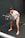 A man holding a barbell in a gym