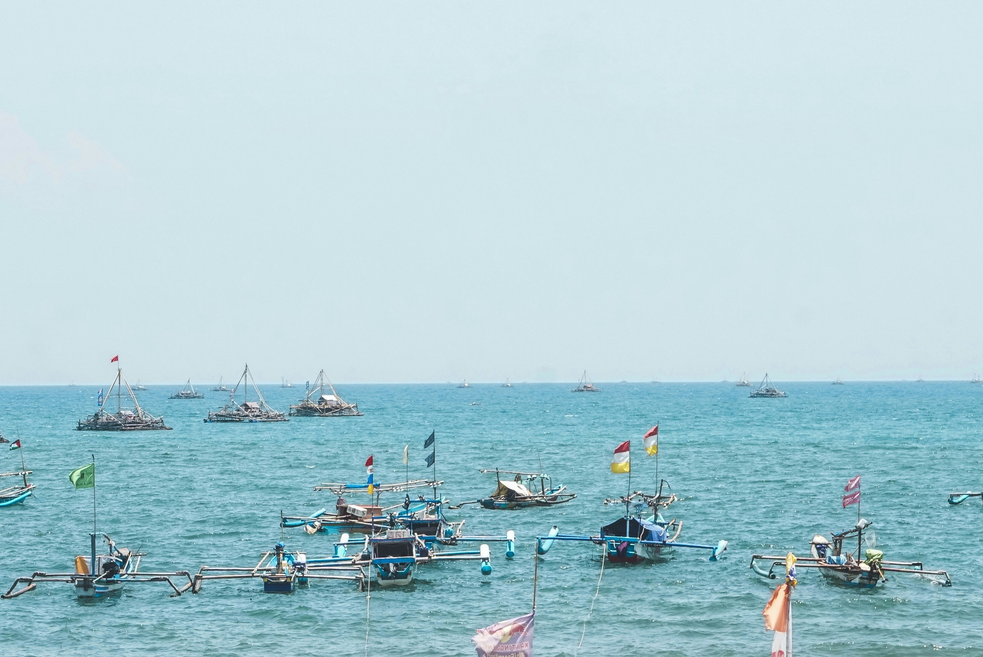 A large body of water filled with lots of boats